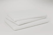 Three folded layers of the protector stacked on a pale studio ground. Rendering, not a photograph of shipped goods.