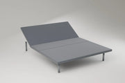 The adjustable base with the head section raised, standing on slim metal legs. Rendering, not a photograph of shipped goods.
